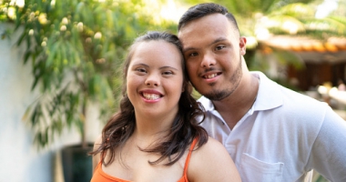 Portrait of happy special needs couple looking at camera