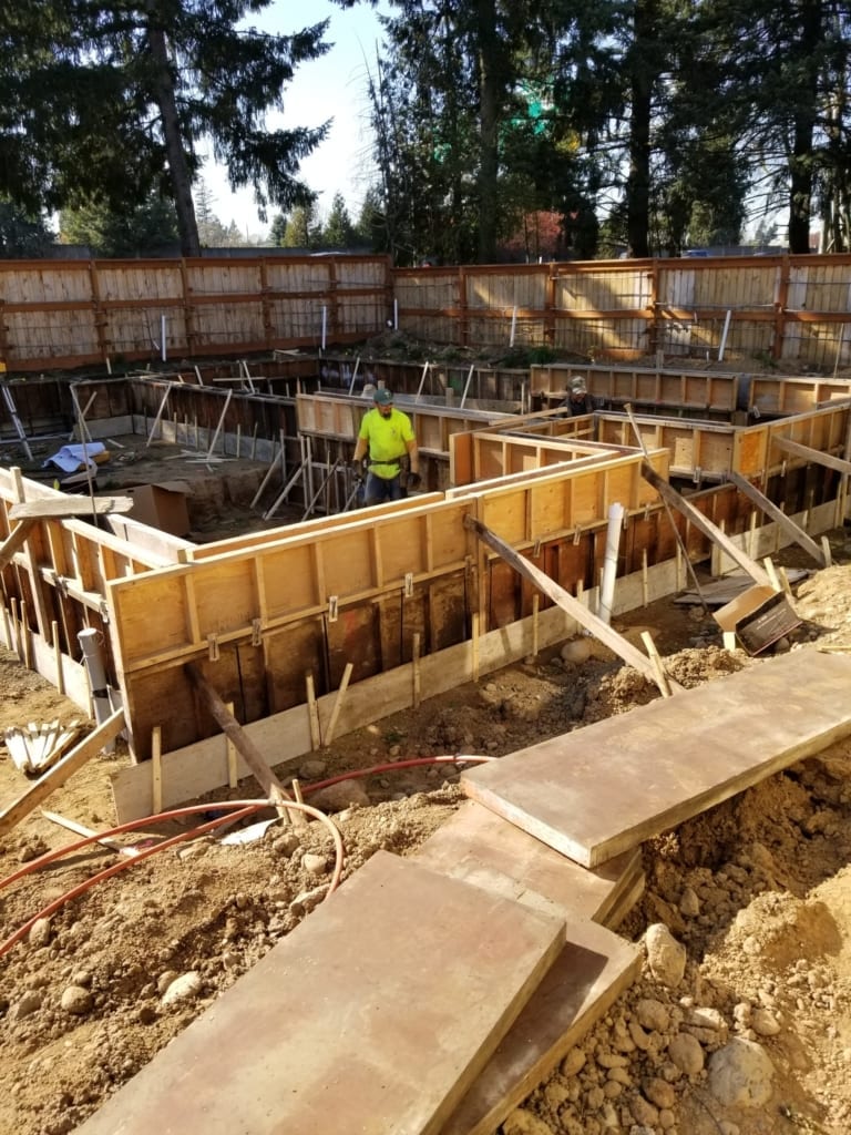 Construction worker laying foundation