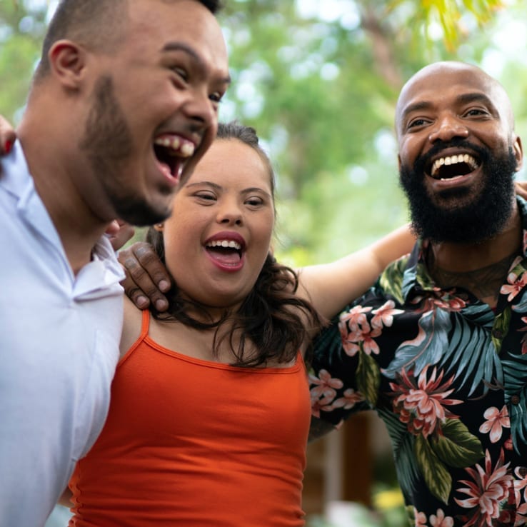 A young group of friends laughing.