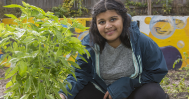 girl sitting in a garden