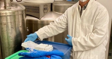 A researcher in the Disis Lab at the Cancer Vaccine Institute at University of Washington Medicine shows research samples.