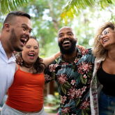 A young group of friends laughing.