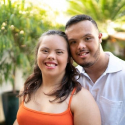 A young couple smiling.