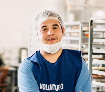 Young adult working at candy factory.